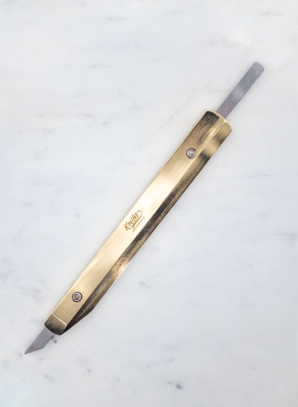 Refillable leather knife for cutting out leather patterns