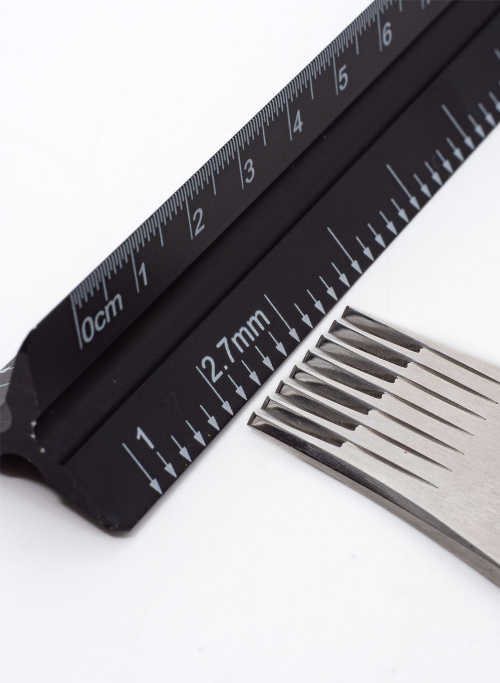 Kevin Lee triangular ruler for cm and stitches per inch