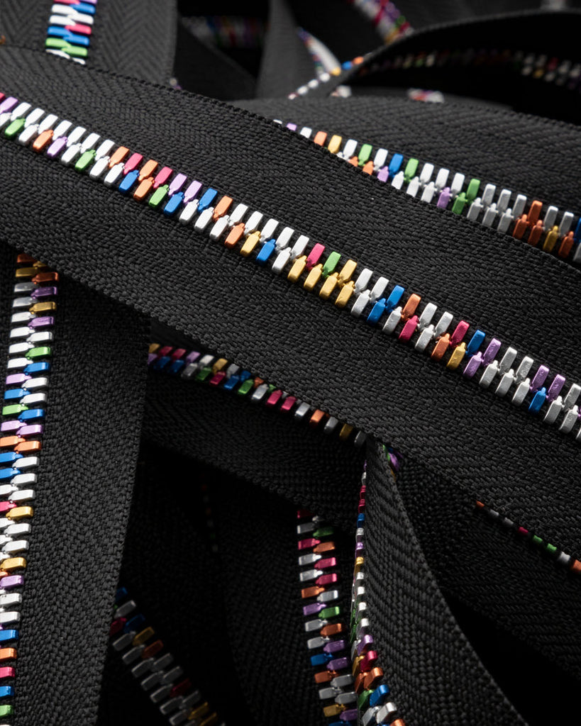 Excella® Light | Rainbow colored YKK zipper on a roll